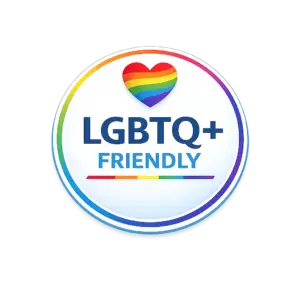 Rainbow heart with "LGBTQ+ Friendly" text in circular badge design.